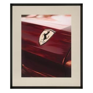Framed photo of car emblem, horse silhouette