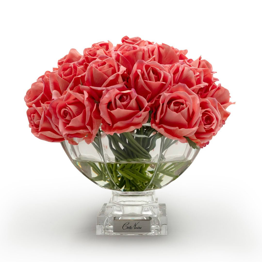 Bouquet of red roses in clear glass vase