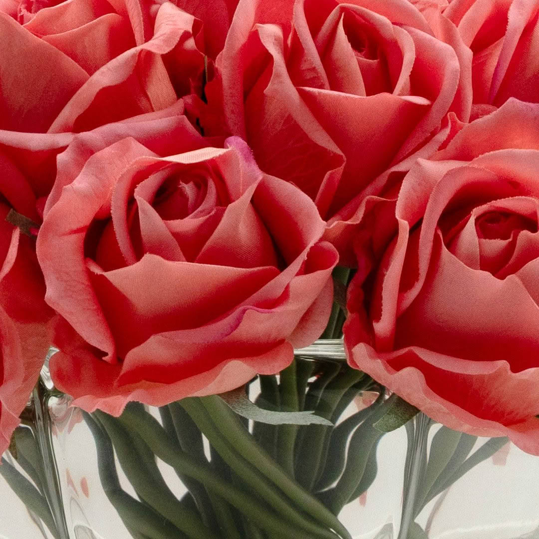 Close-up of red roses in a glass vase