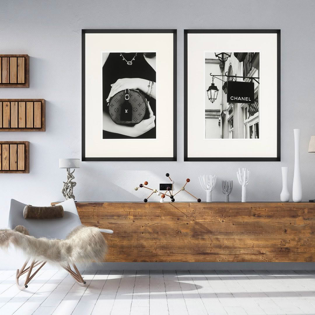 Modern living room with framed luxury brand posters