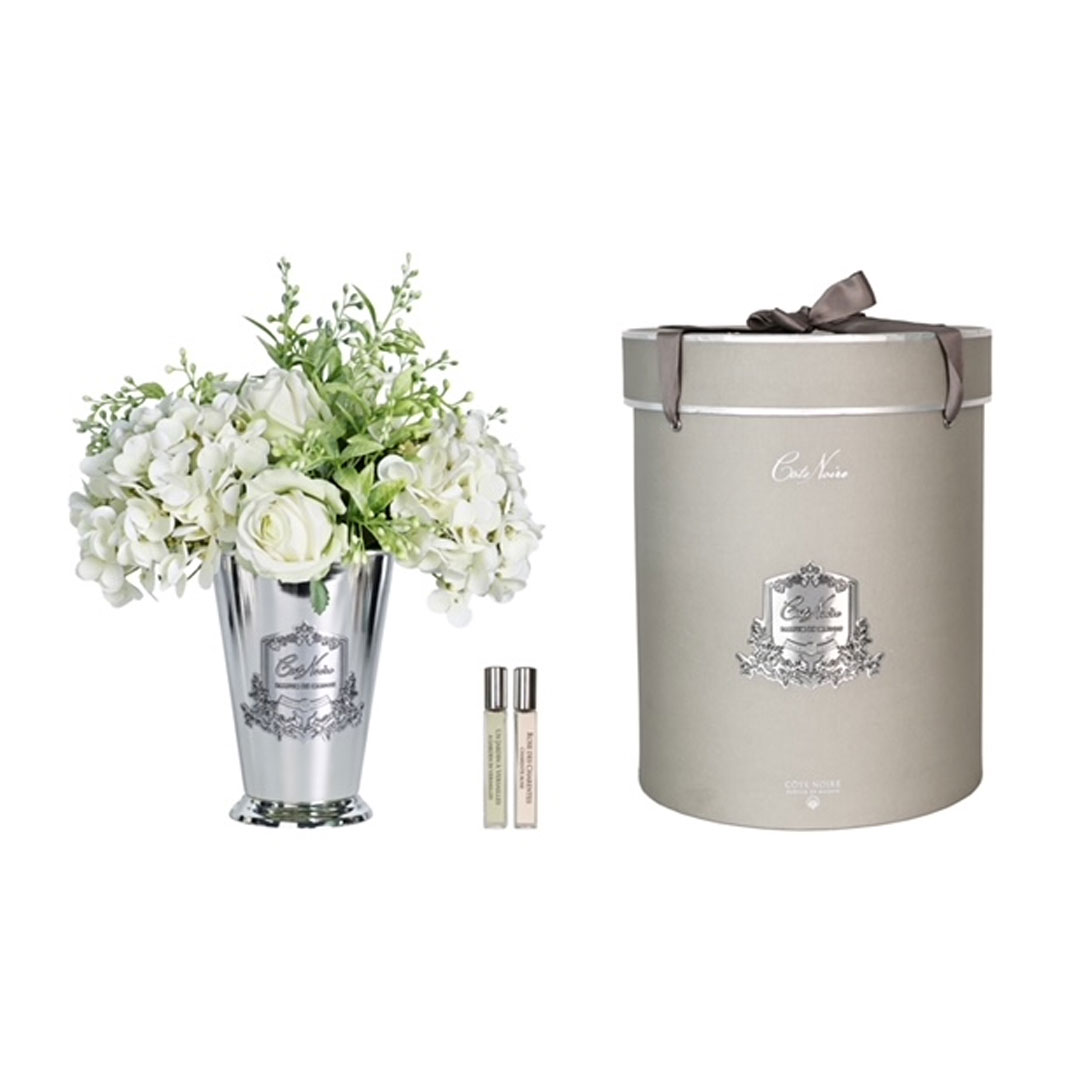 Floral arrangement in silver vase and perfumed candle set