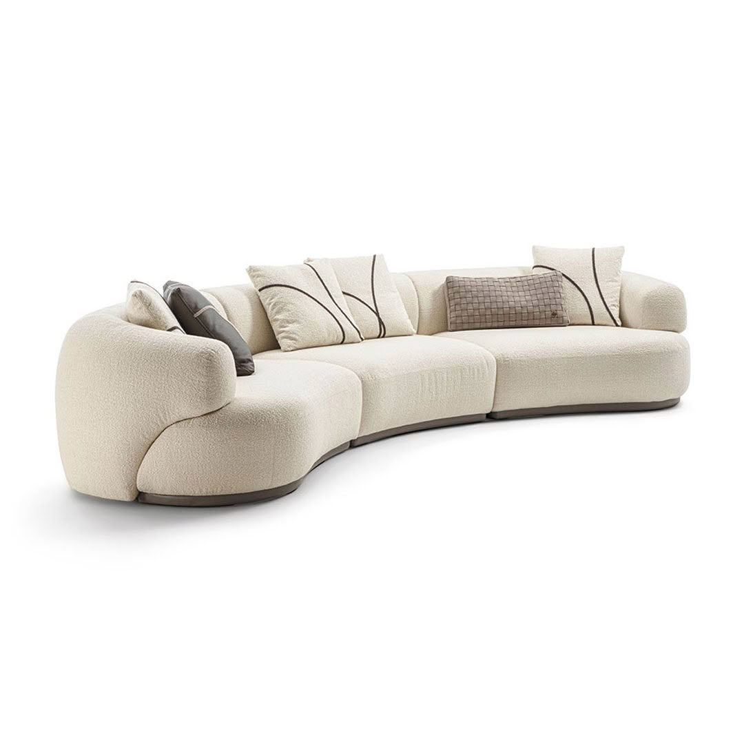 Modern beige sectional sofa with cushions isolated on white