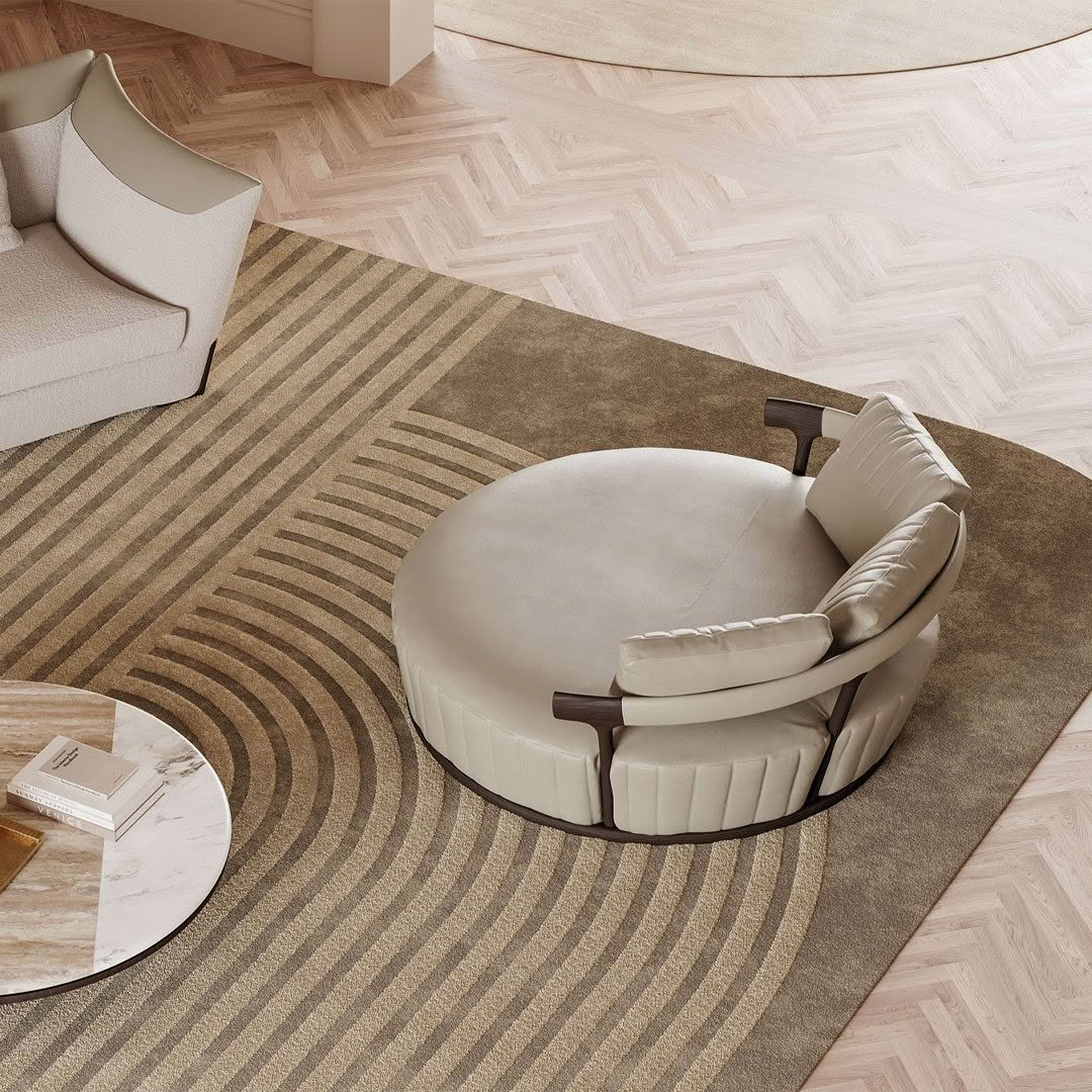 Modern living room with circular sofa and striped rug
