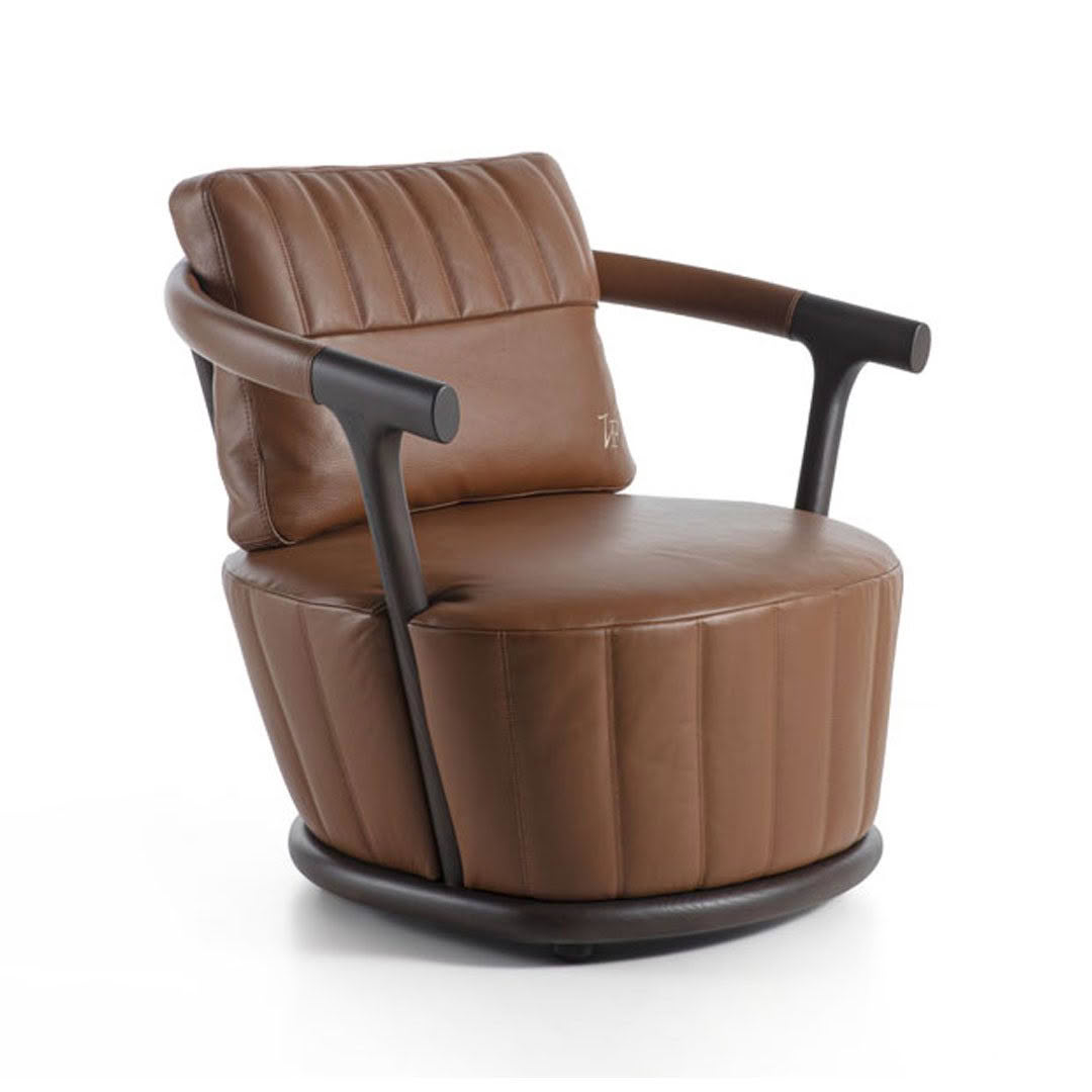 Brown leather modern swivel armchair isolated on white