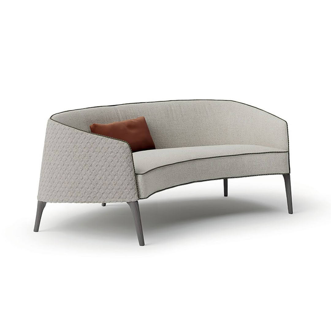 Elegant curved sofa with gray fabric and cushion