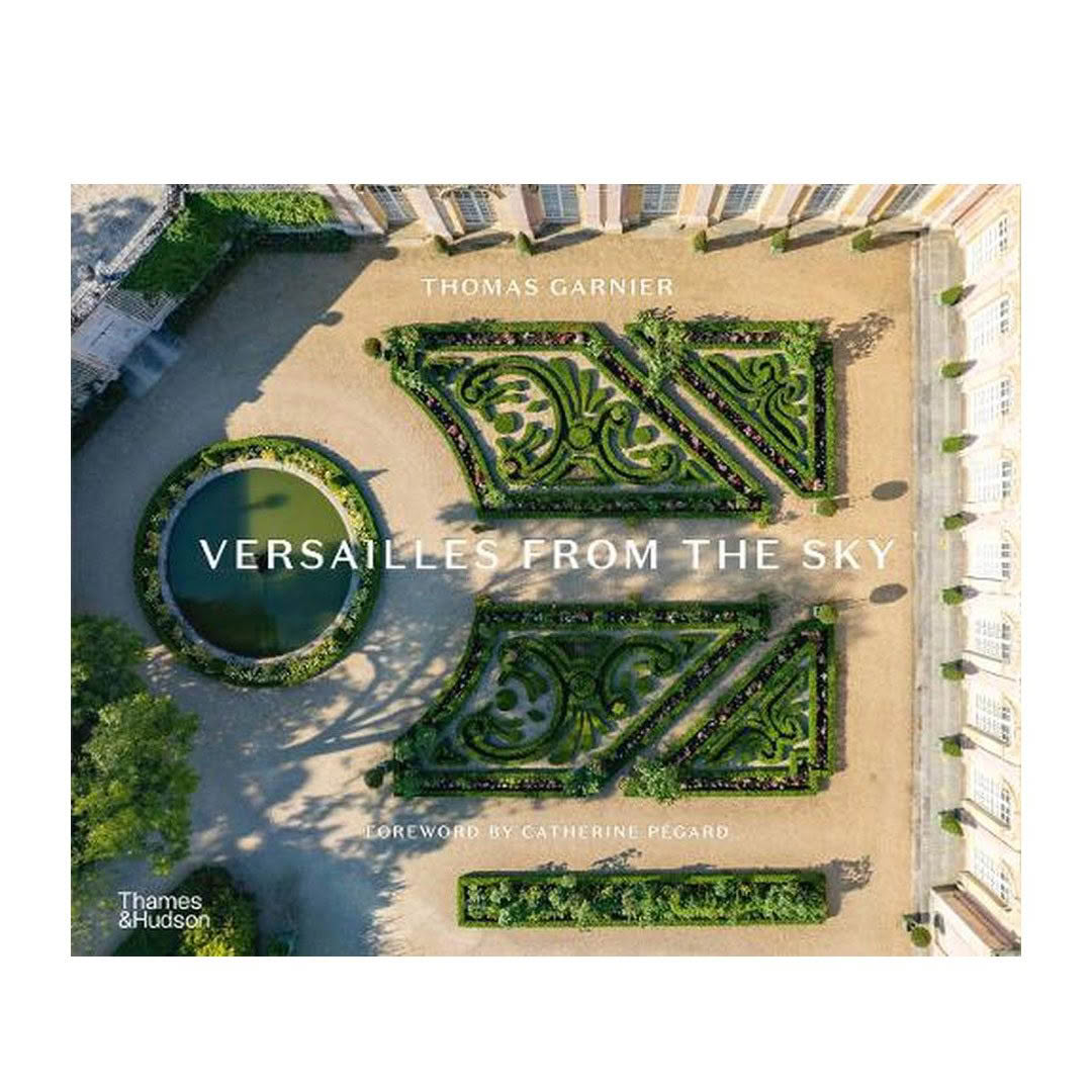 Aerial view of Versailles gardens and book cover text