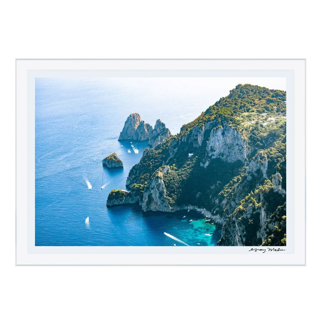 Aerial view of rocky coastline with boats