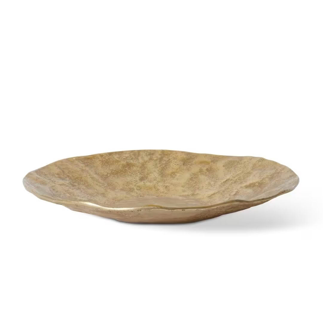 Golden textured decorative ceramic bowl on white