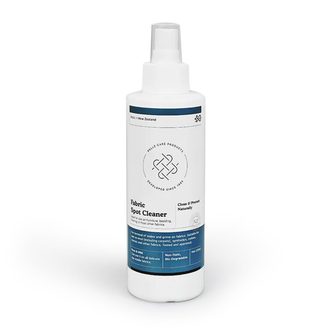 Bottle of fabric spot cleaner on white background