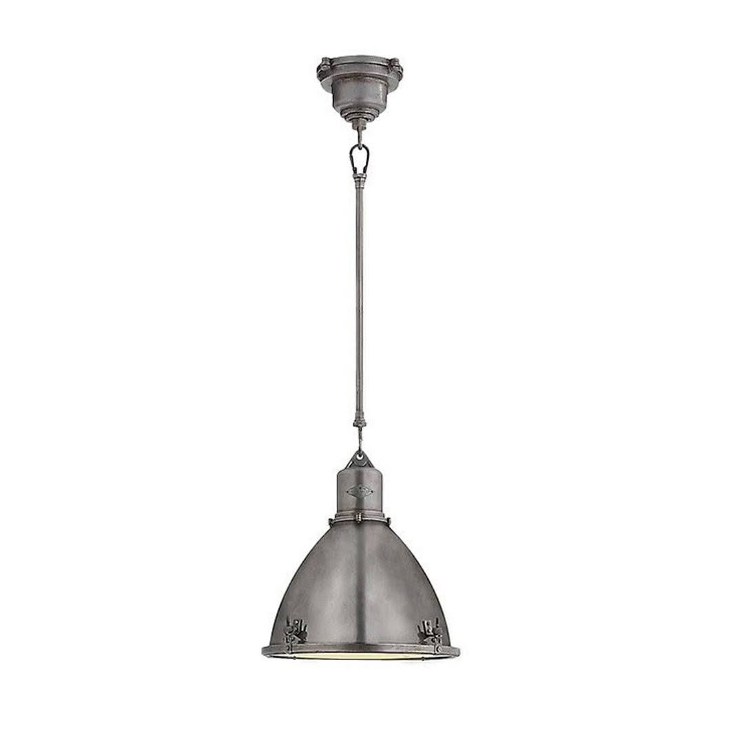 Industrial metal pendant light hanging on ceiling