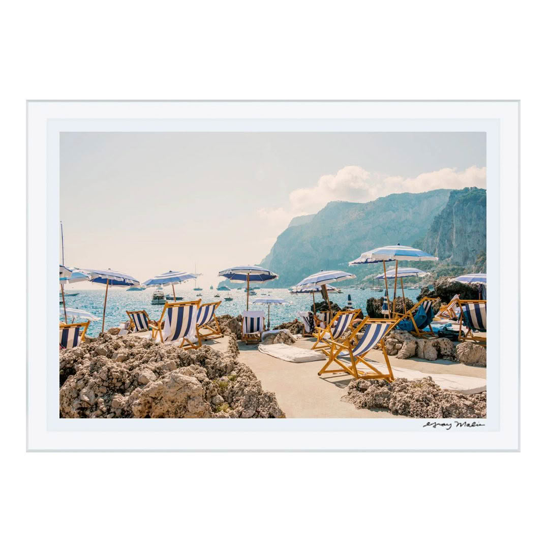 Scenic coastal view with beach umbrellas and sunbeds