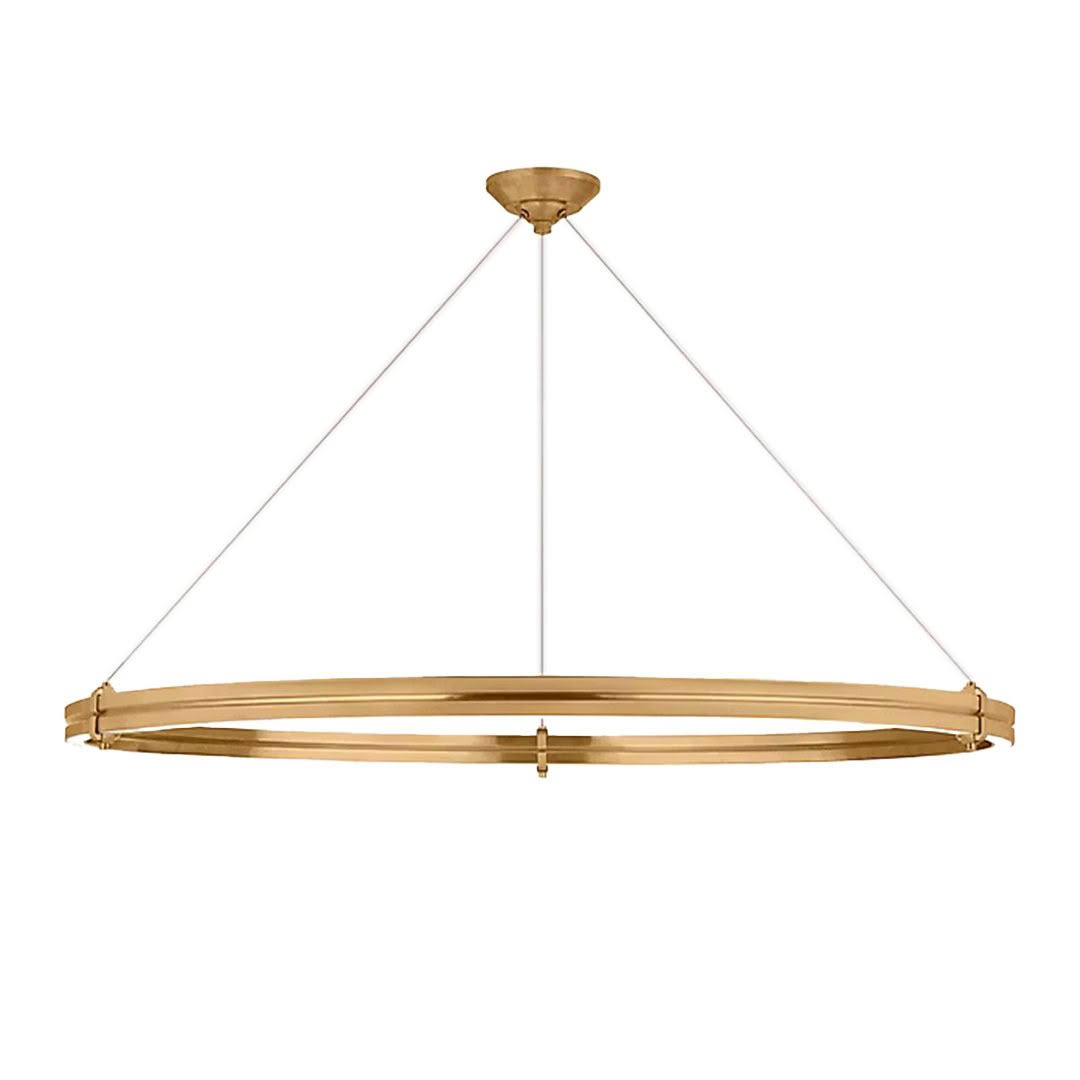 Gold circular suspended light fixture on white background