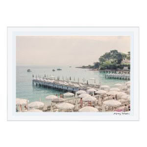 Seaside resort with umbrellas, beach chairs, and pier