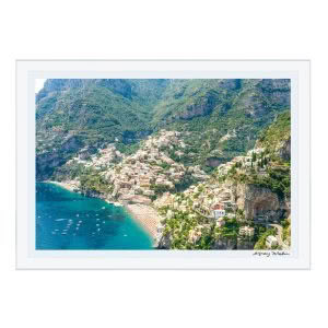 Aerial view of coastal town nestled in mountains