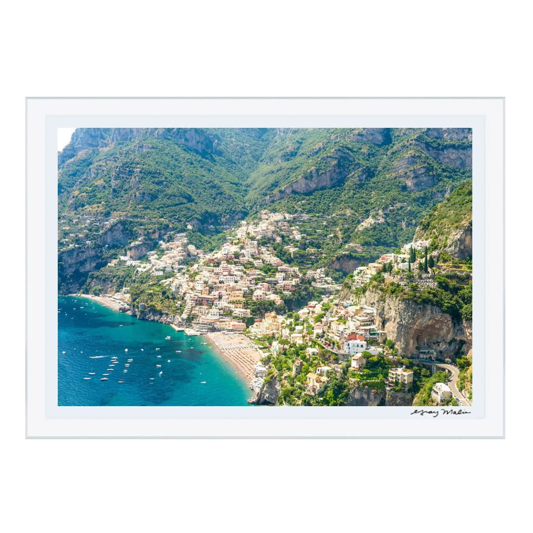 Aerial view of coastal town nestled in mountains