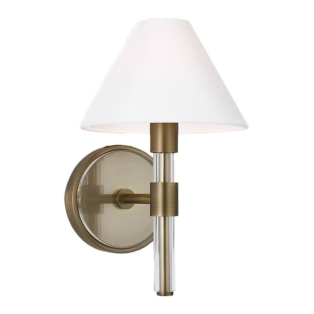 Brass wall sconce with white lampshade
