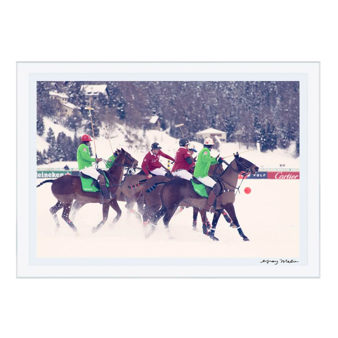 Polo players competing in snowy landscape