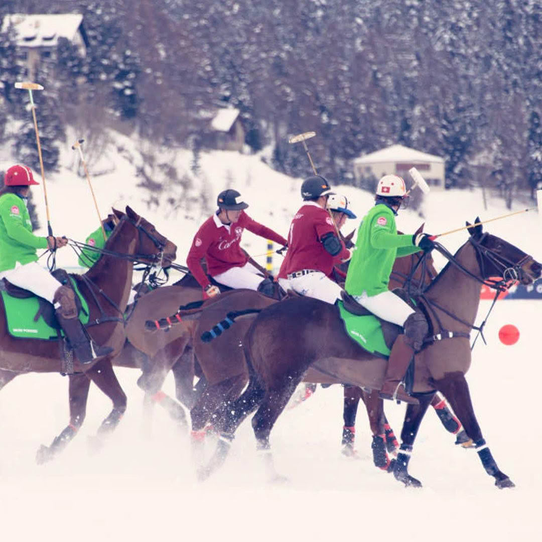 Snow polo players competing in wintry landscape