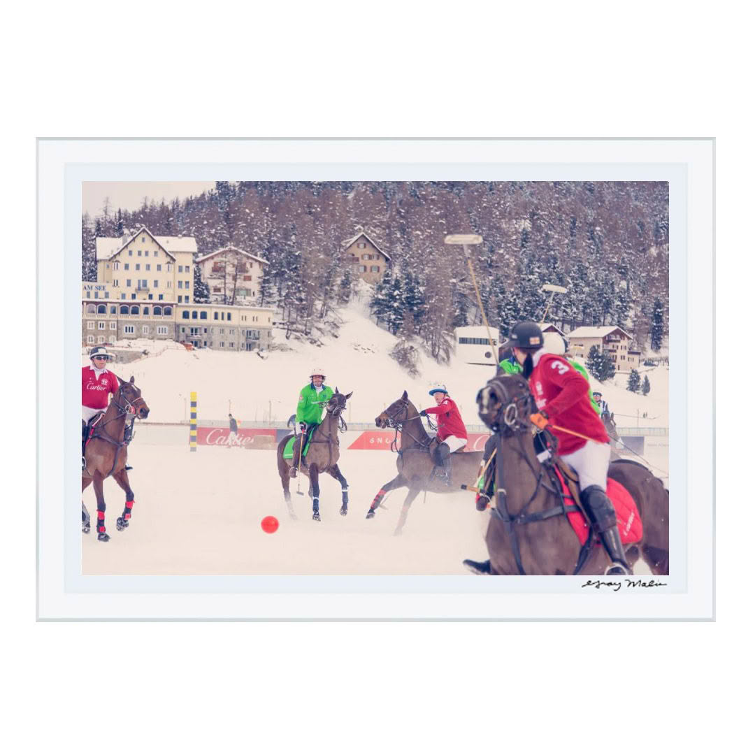 Snowy polo match with players on horses