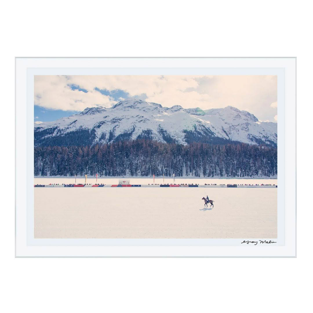 Skijoring under snowy mountain landscape