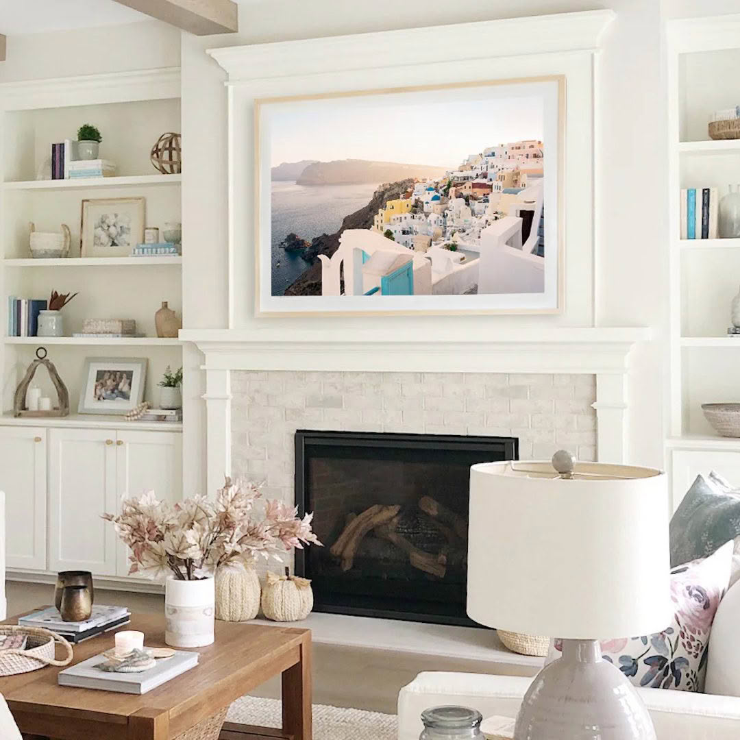 Cozy living room with framed scenic coastal artwork