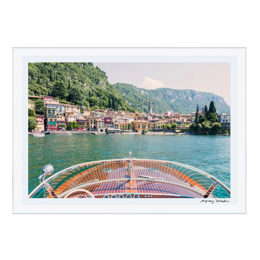 Colorful lakeside village from boat perspective