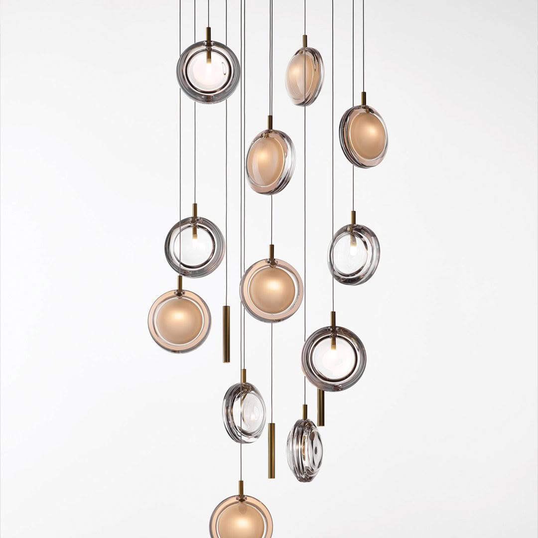 Elegant circular pendant lights in varied metallic finishes