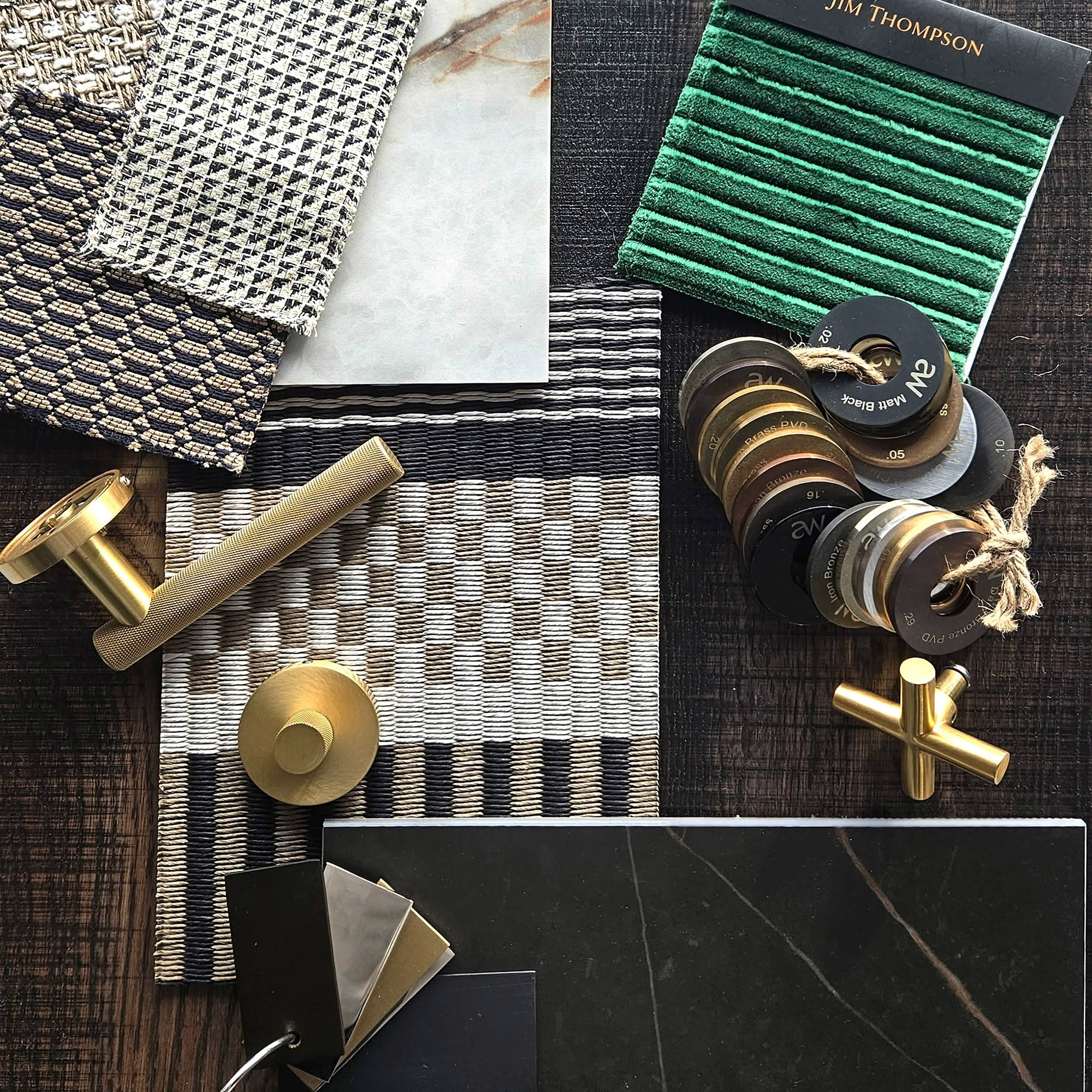 Assorted interior design samples with fabrics and hardware