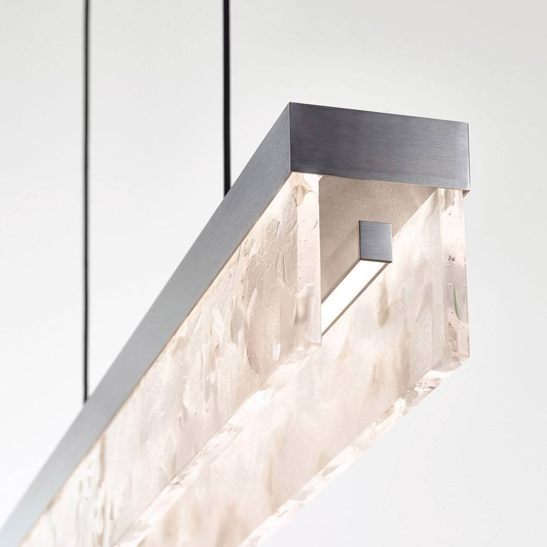 Modern textured glass wall sconce with metal frame
