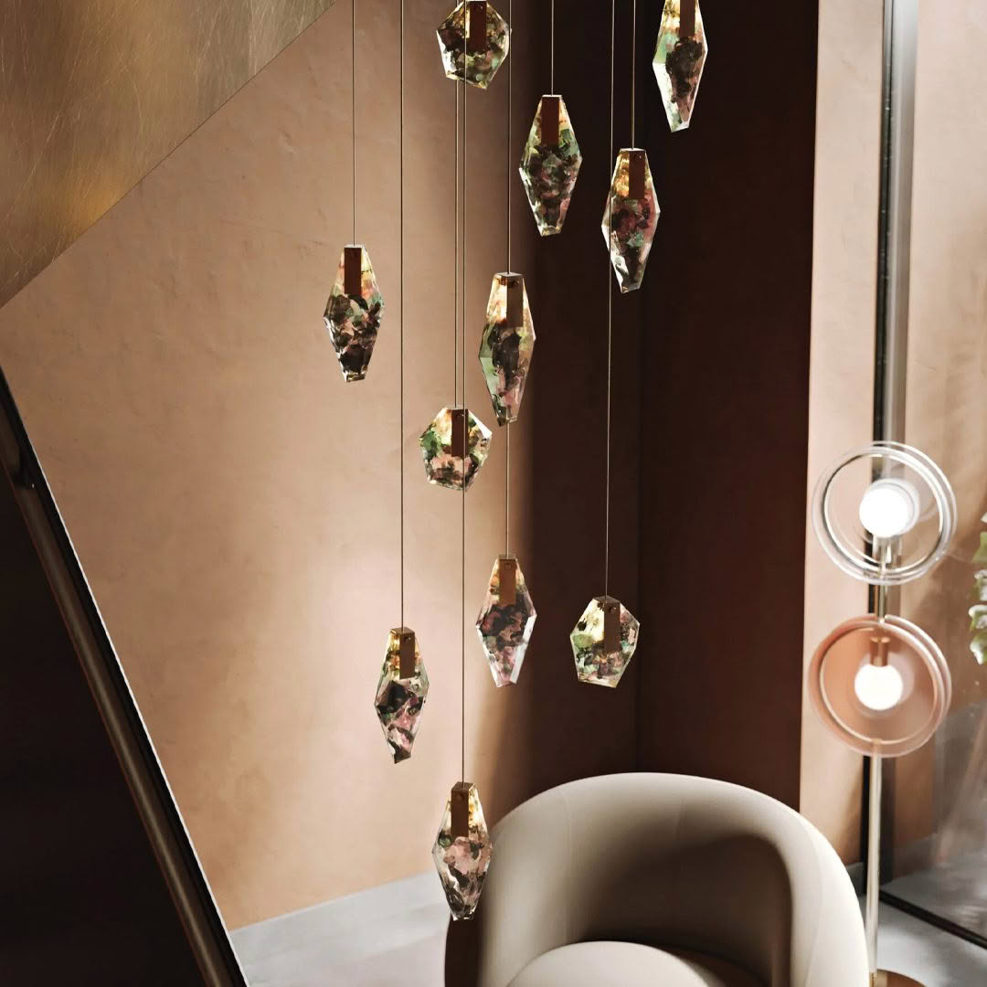 Elegant crystal pendants hanging in warm-lit modern interior