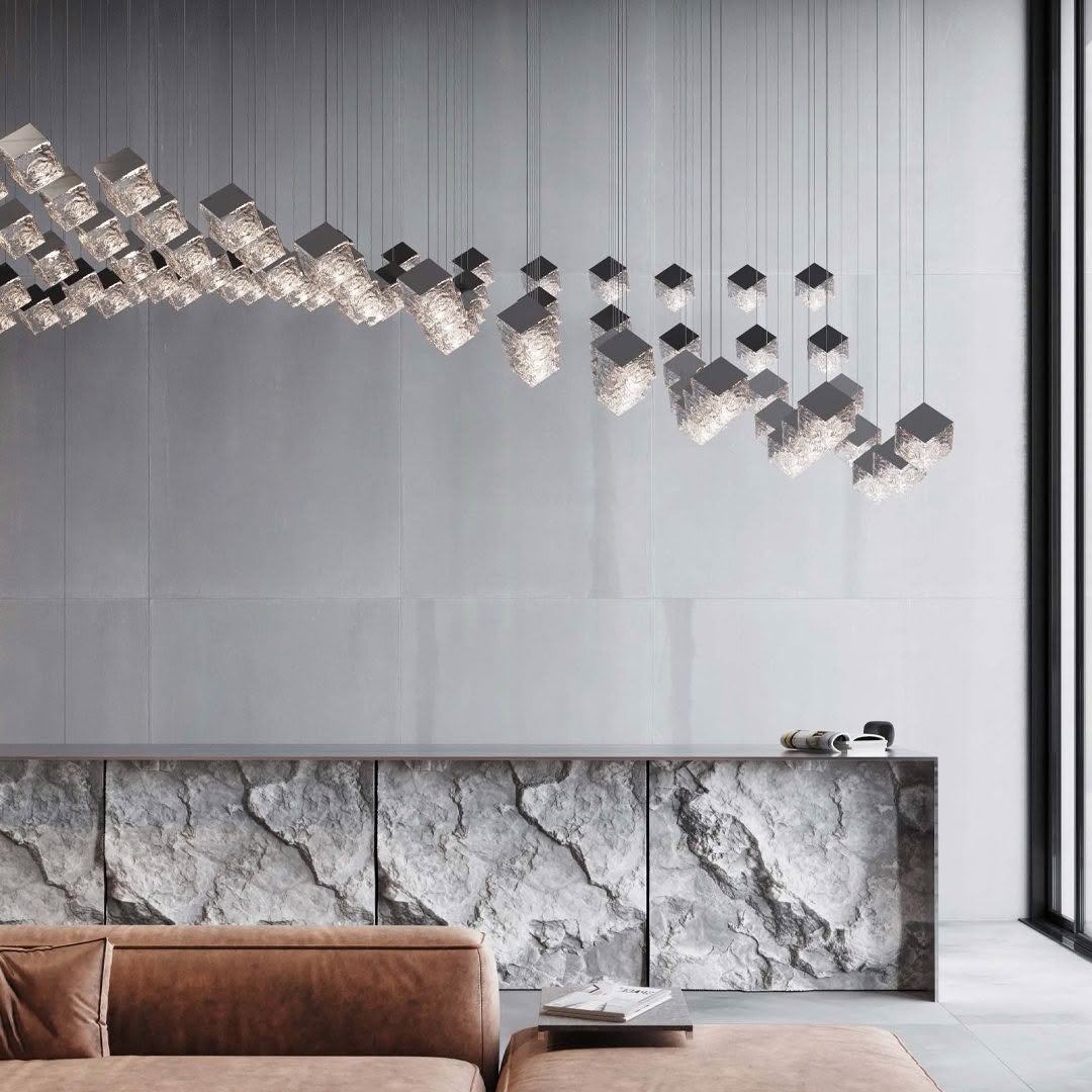 Modern interior with geometric hanging lights and stone cabinet