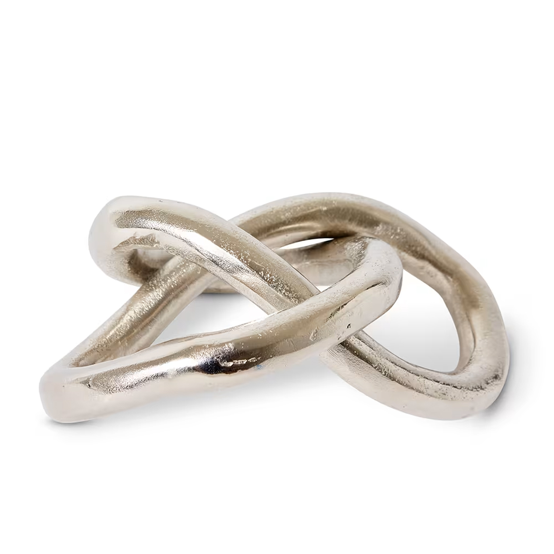 Intertwined silver rings on white background