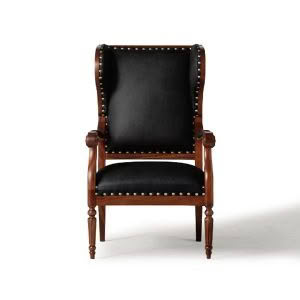 Antique brown wooden armchair with black leather upholstery