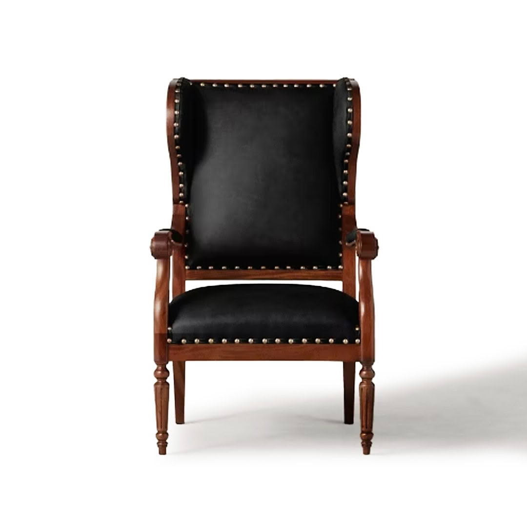 Antique brown wooden armchair with black leather upholstery