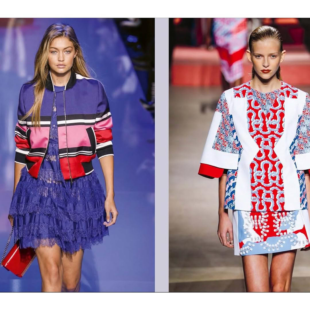 Two models showcase colorful designer runway outfits