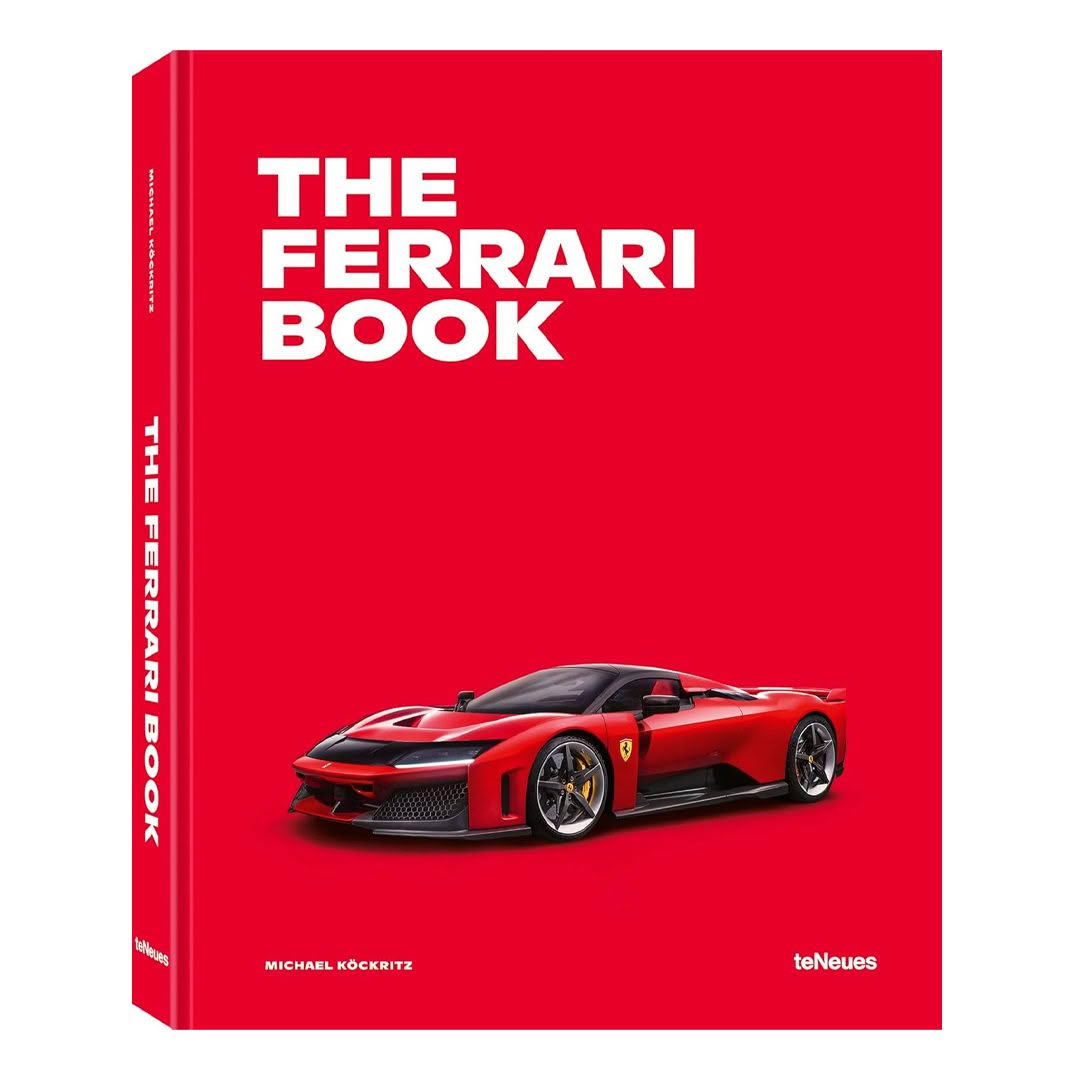 Red Ferrari book with car image on cover