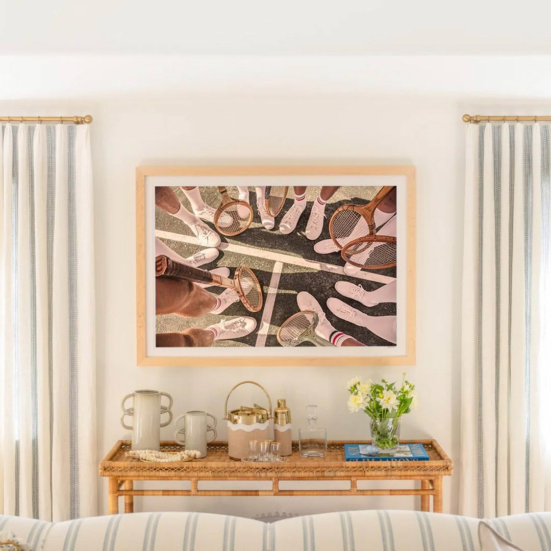 Artistic view of people's feet with tennis rackets