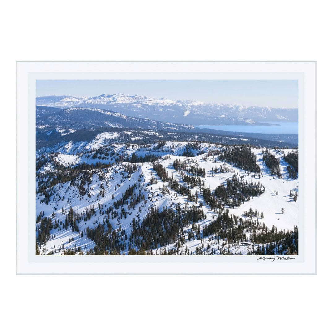 Aerial winter view of snowy mountains and clear sky
