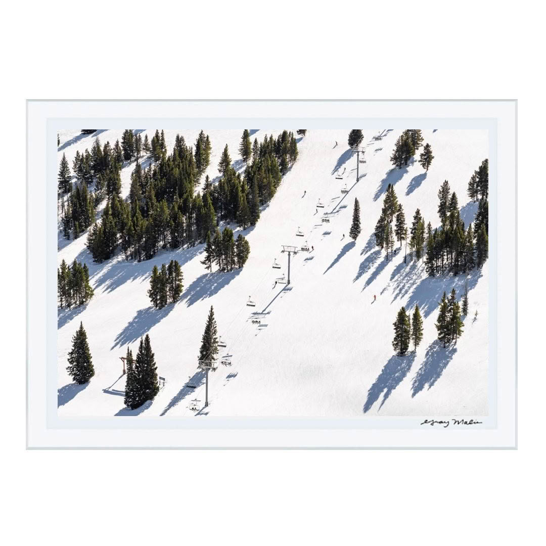Snowy mountain with ski lift and skiers