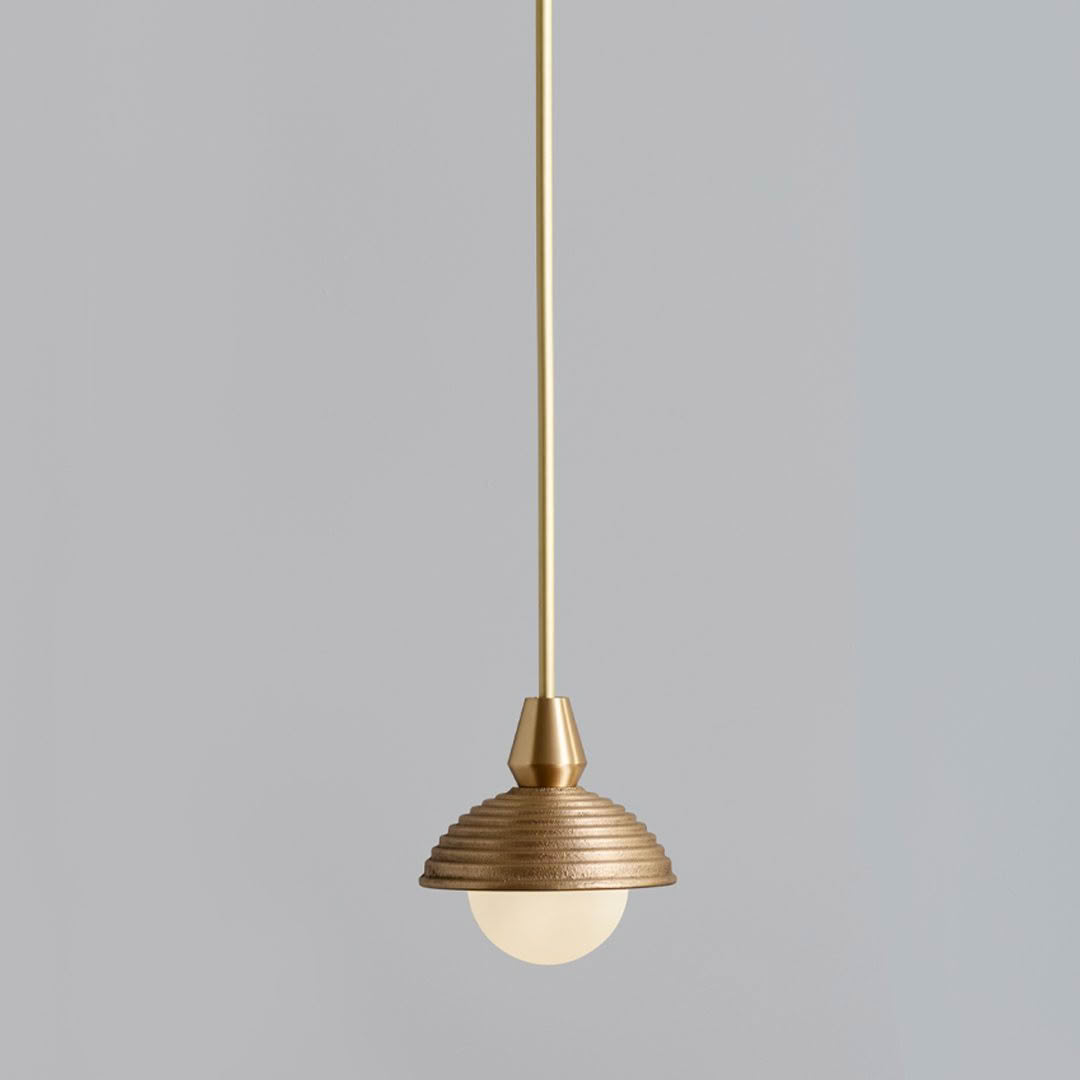 Elegant brass pendant light with ridged shade