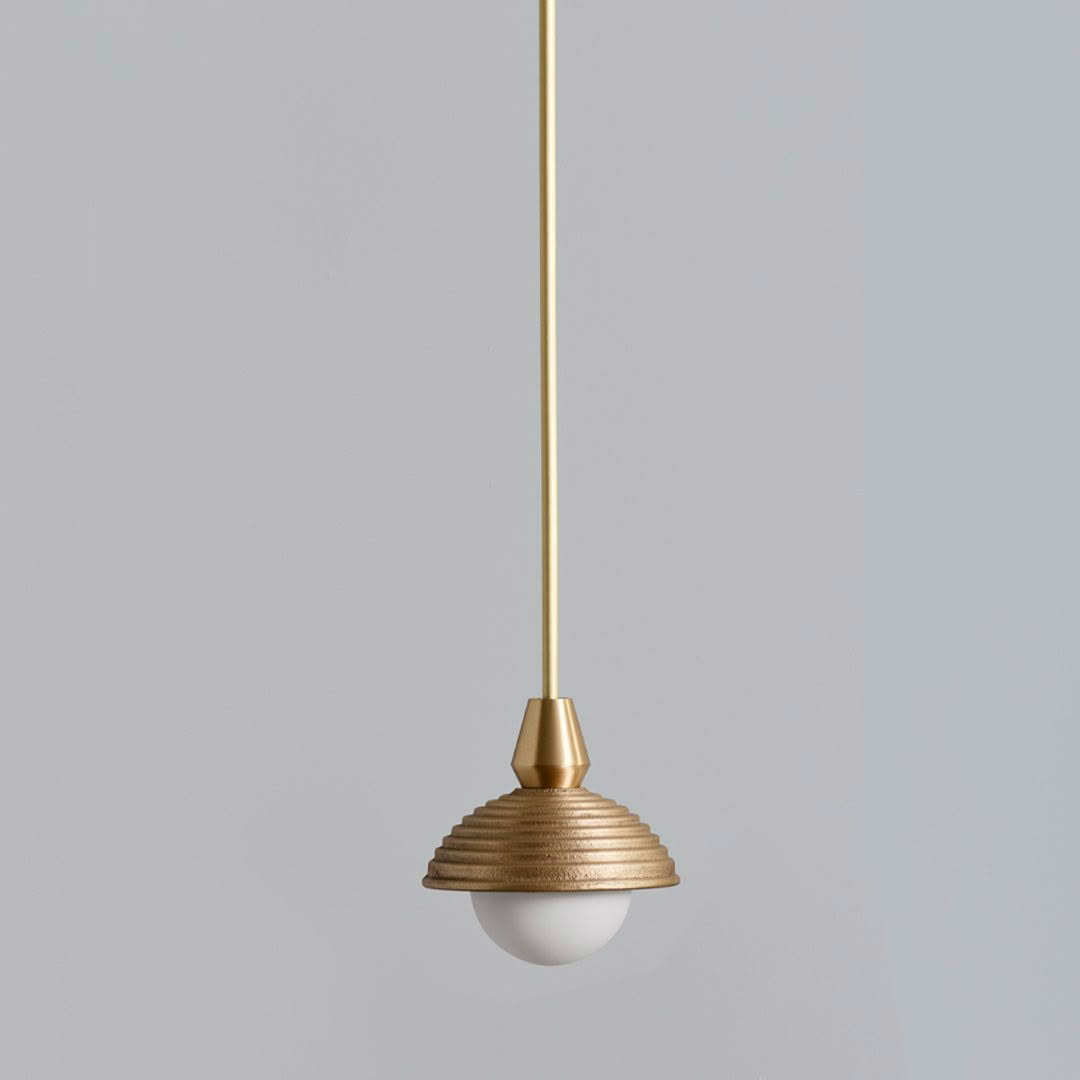 Modern gold pendant light with ribbed design