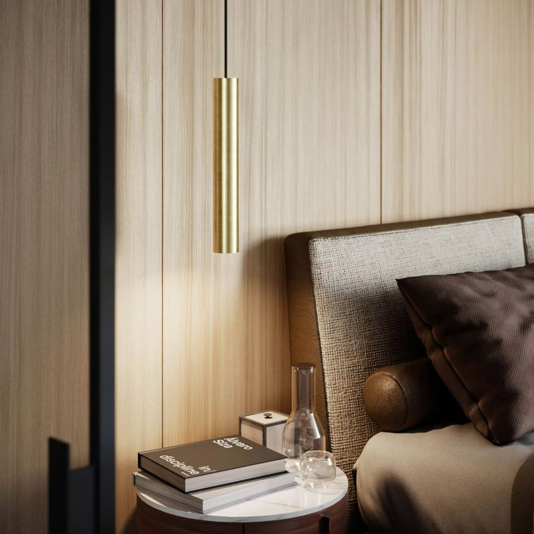 Elegant bedside with gold lamp and neutral tones