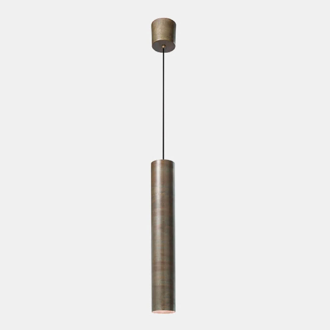 Cylindrical bronze pendant light hanging from ceiling