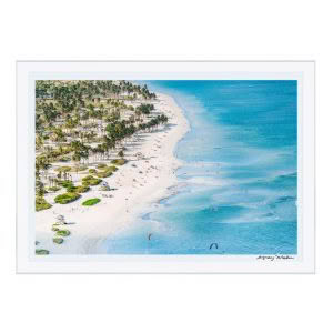 Aerial view of crowded tropical beach with palm trees