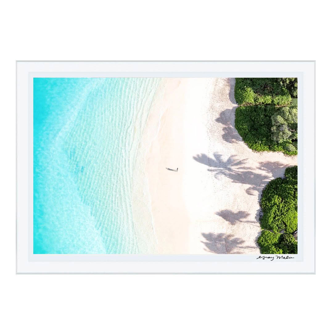 Aerial view of sandy beach with clear turquoise waters