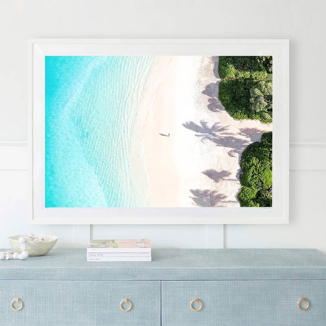 Framed aerial beach photo in modern living room