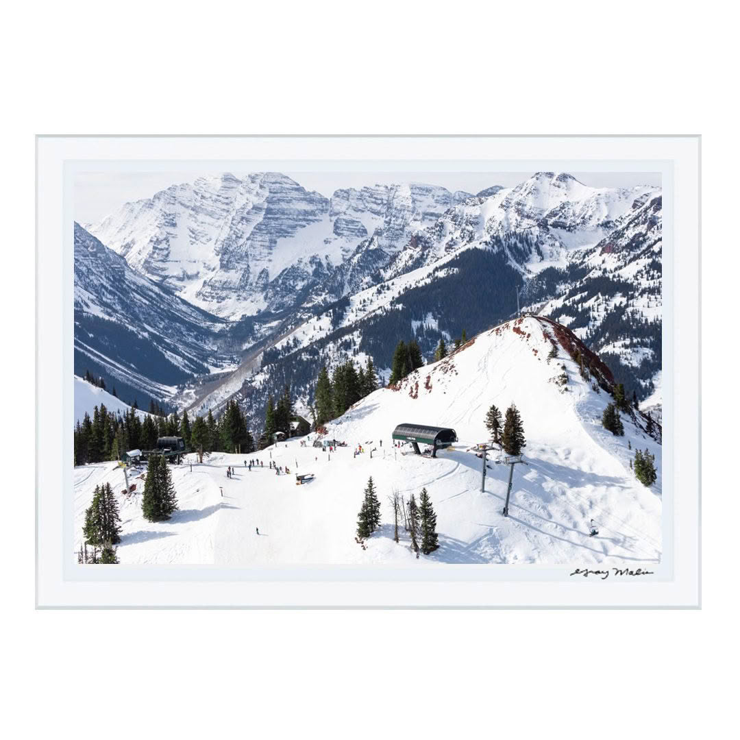 Snow-covered ski slopes with mountains in background