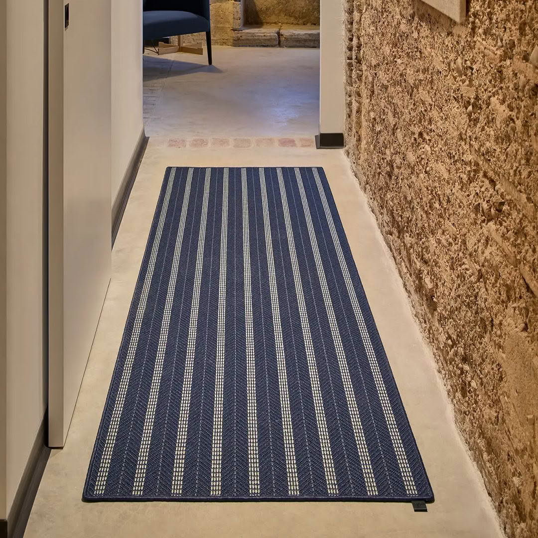 Blue striped runner rug in modern corridor setting