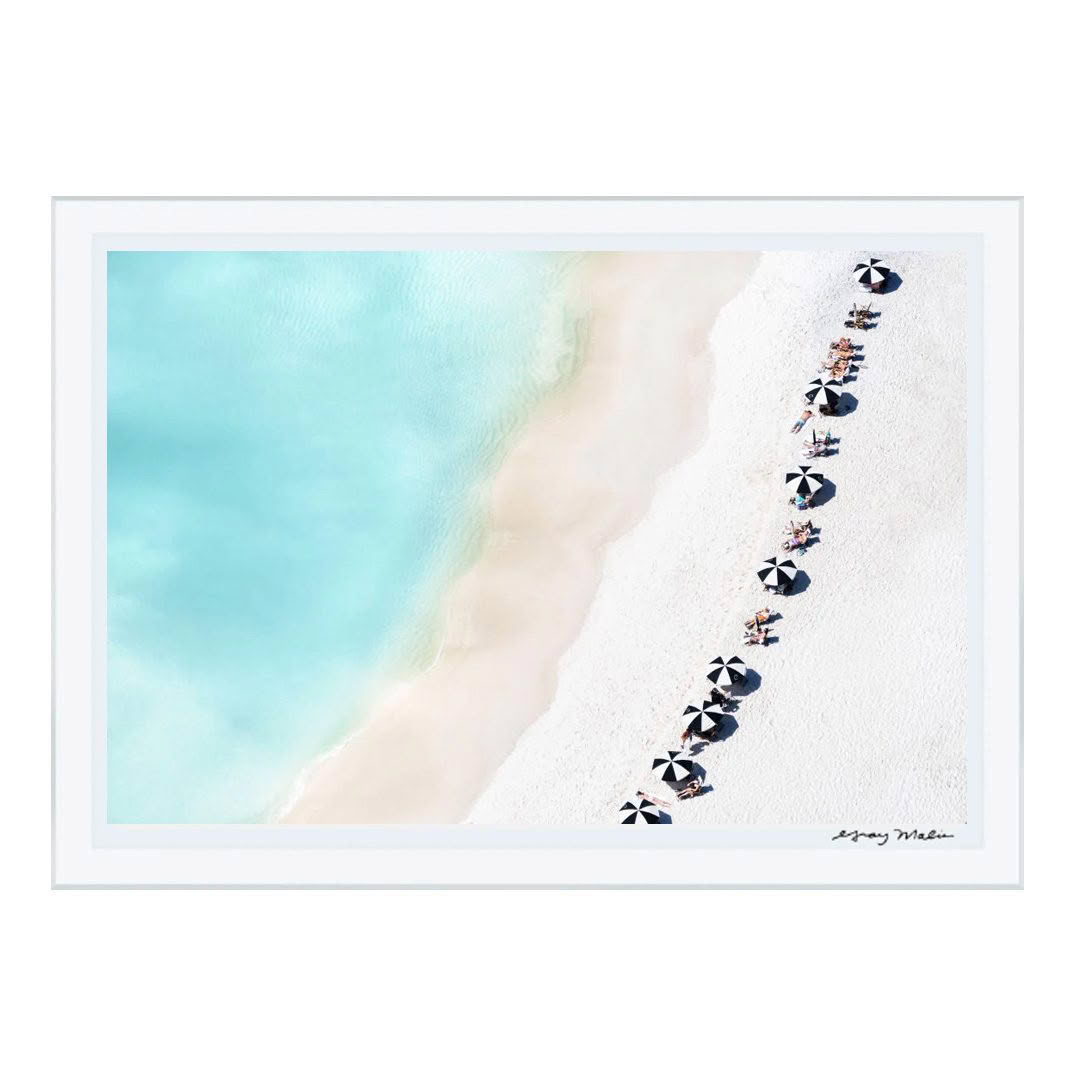 Aerial view of people relaxing under umbrellas on beach