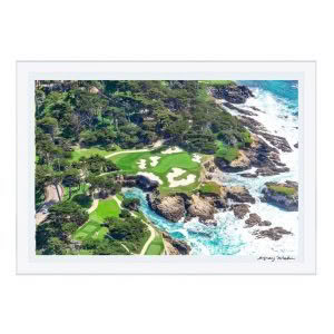 Aerial view of coastal golf course with rocky shores